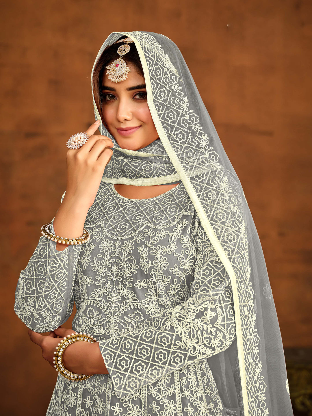 Traditional grey net salwar kameez, detailed thread embroidery for USA occasions.