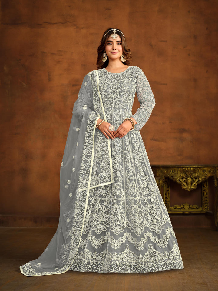 Elegant grey net salwar kameez with heavy thread embroidery, perfect for USA events.