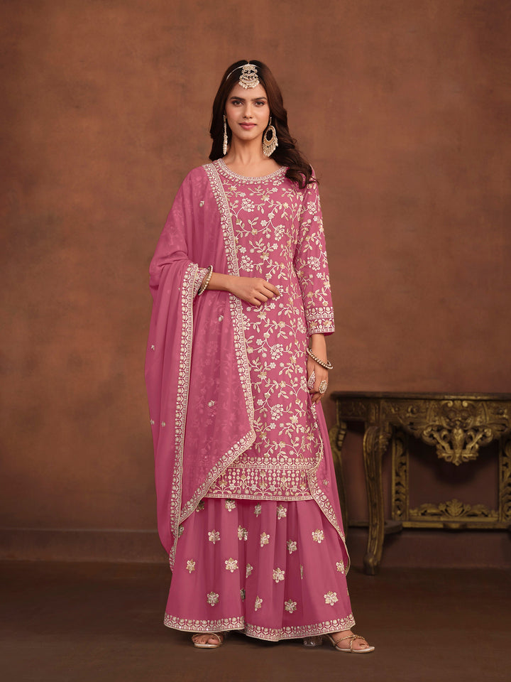 Elegant pink faux georgette salwar kameez with heavy thread embroidery and sequins for USA fashion.