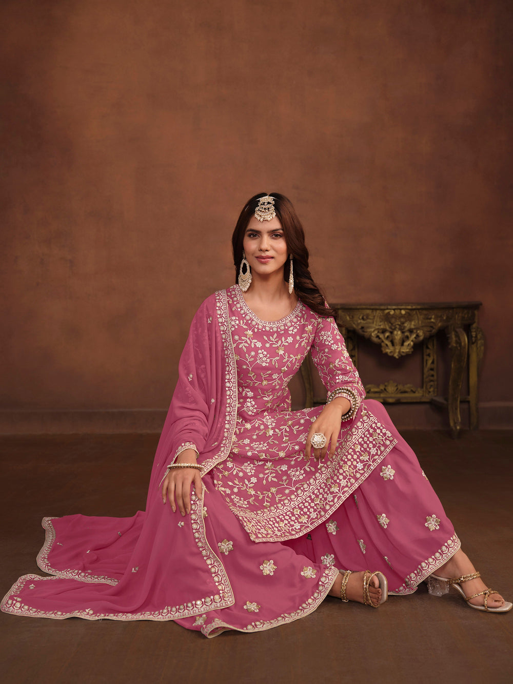 Pink faux georgette salwar kameez, intricate thread embroidery and sequins work, stylish for USA events.