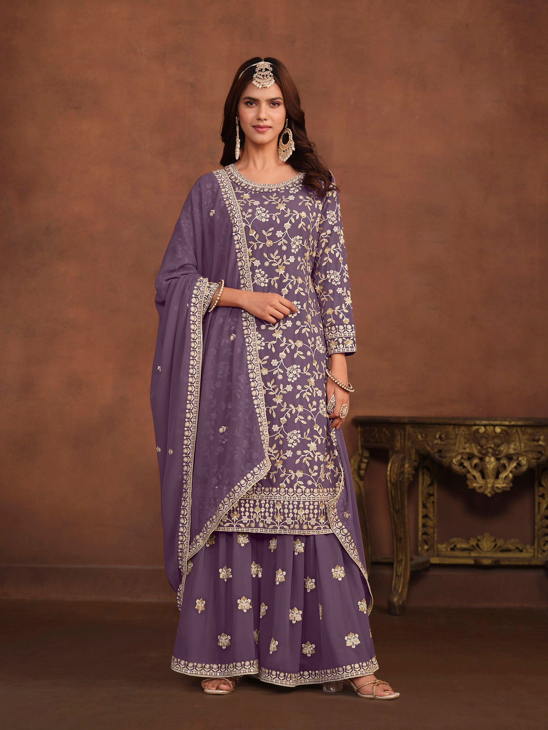 Elegant purple faux georgette salwar kameez with heavy thread embroidery and sequins for USA events.