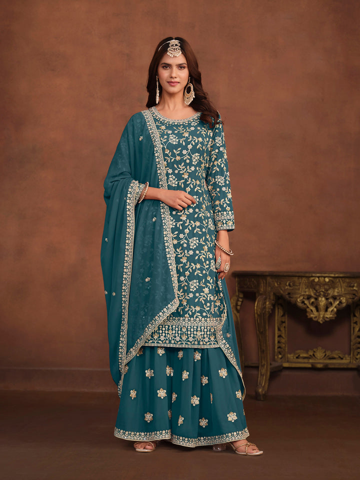 Elegant teal faux georgette salwar kameez with heavy thread embroidery and sequins, perfect for USA fashion.