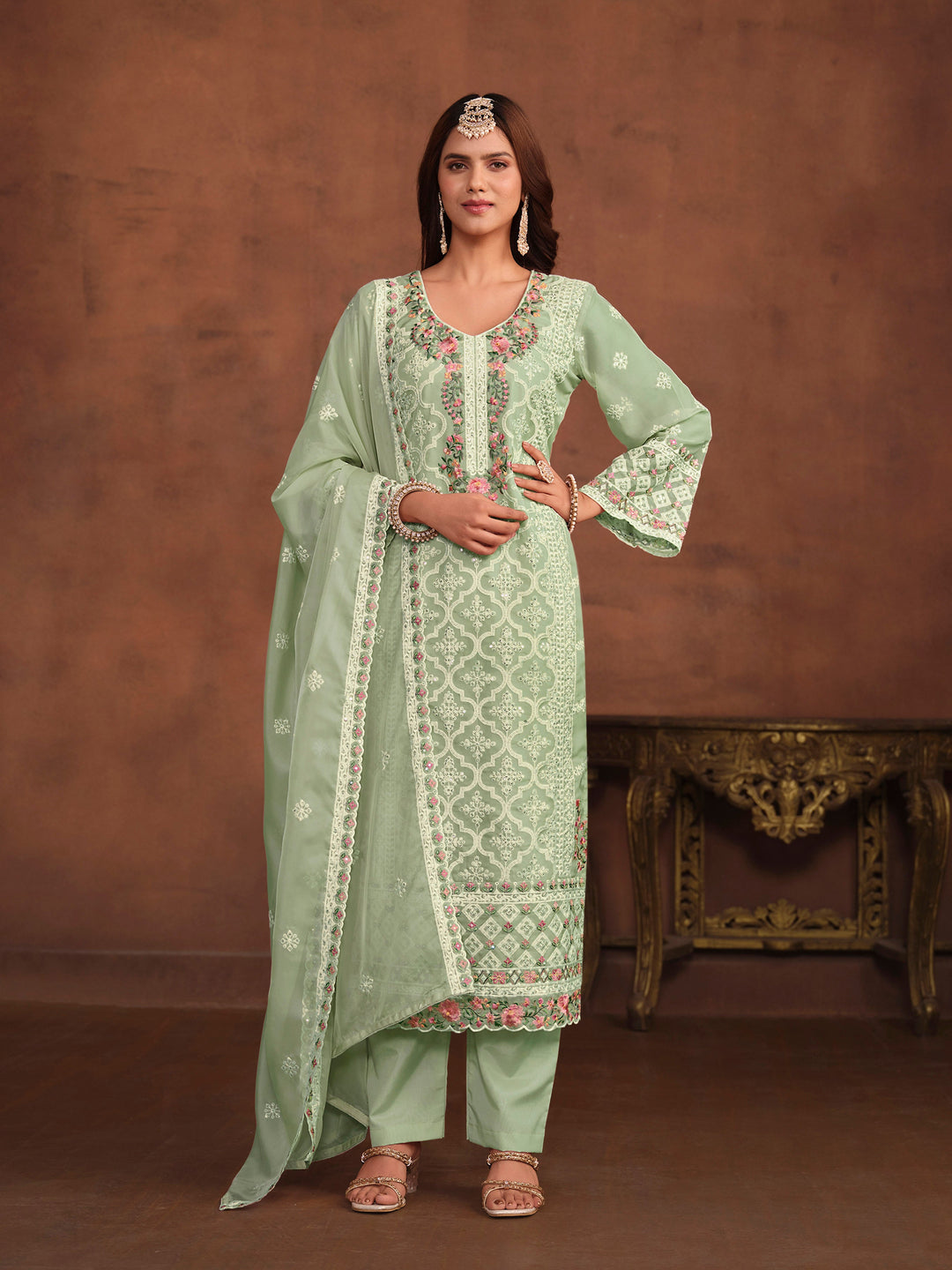 Elegant pista green soft organza salwar kameez with heavy thread embroidery and sequins, ideal for USA fashion.