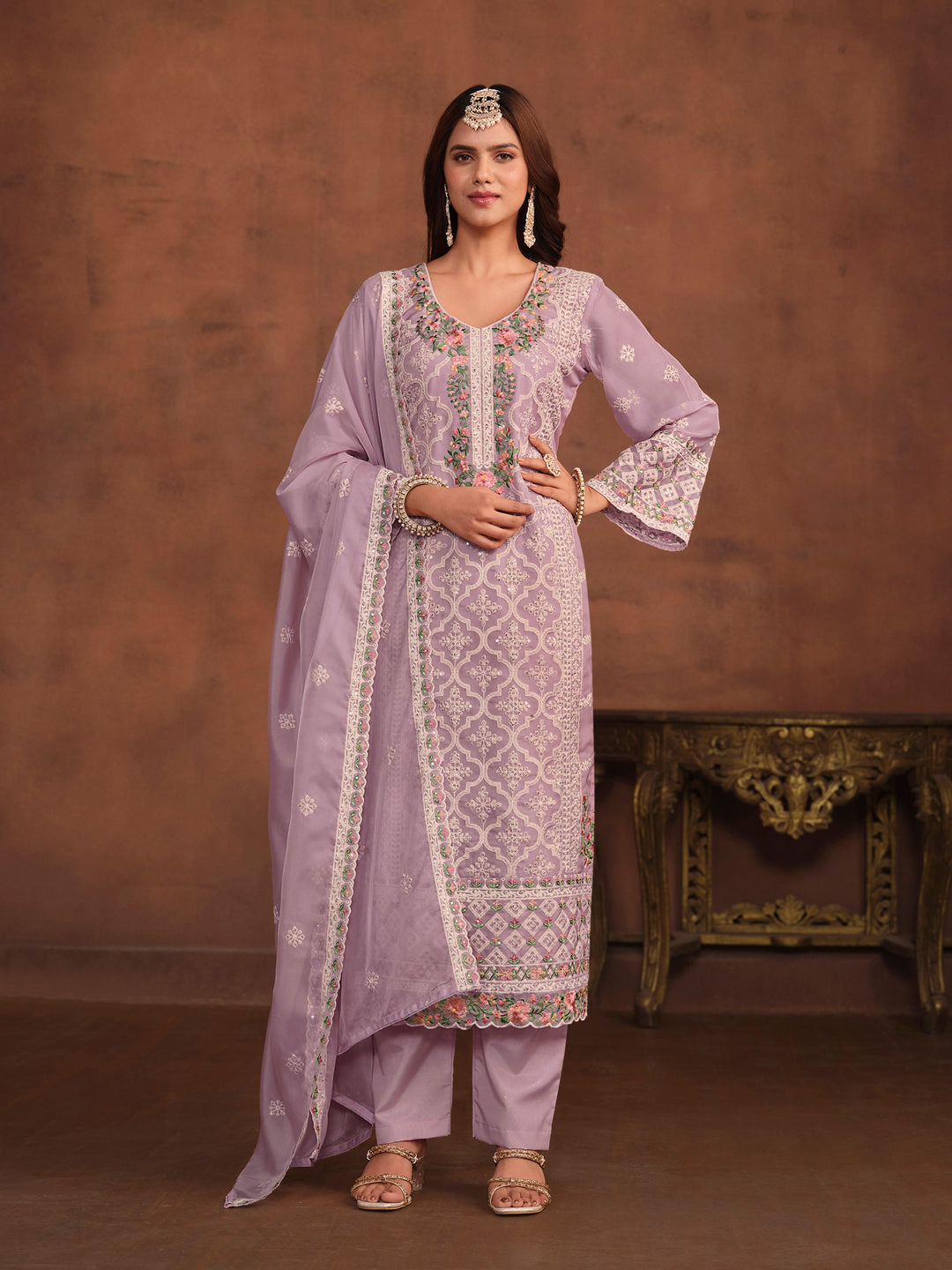 Elegant lavender soft organza salwar kameez with heavy thread embroidery and sequins, perfect for USA fashion.