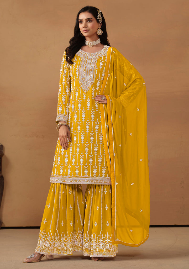 Mustard faux georgette salwar kameez with intricate thread embroidery and sequins, stylish choice for USA events.