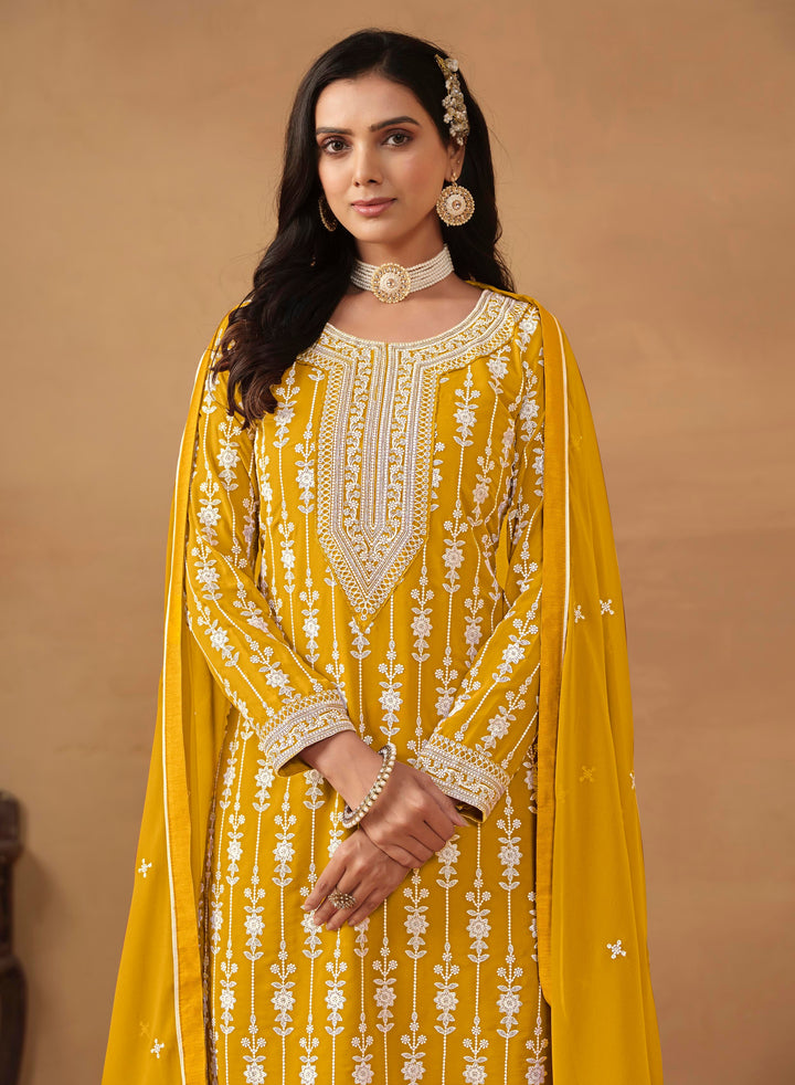 Designer mustard salwar kameez in faux georgette, featuring heavy embroidery and sequins for USA customers.