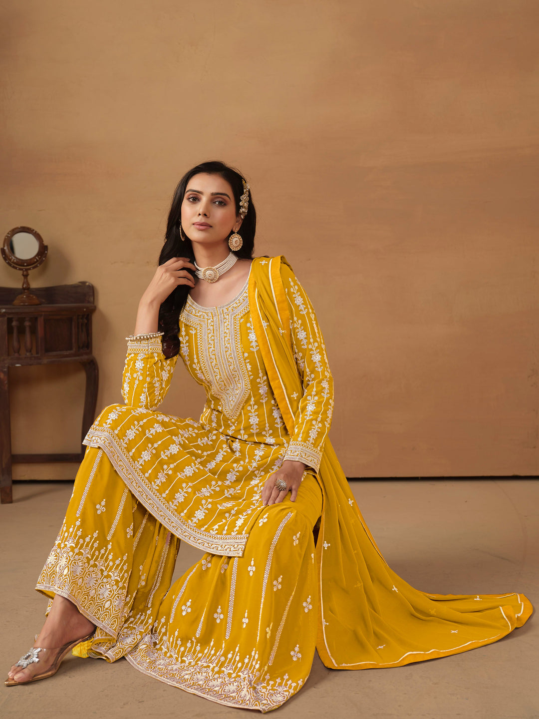 Traditional mustard faux georgette salwar kameez with detailed embroidery and sequins, perfect for USA occasions.