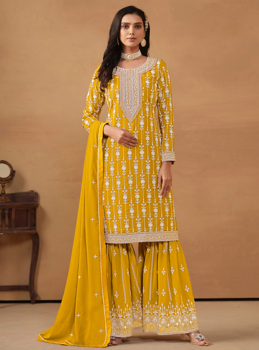 Elegant mustard faux georgette salwar kameez with heavy thread embroidery and sequins, ideal for USA fashion.