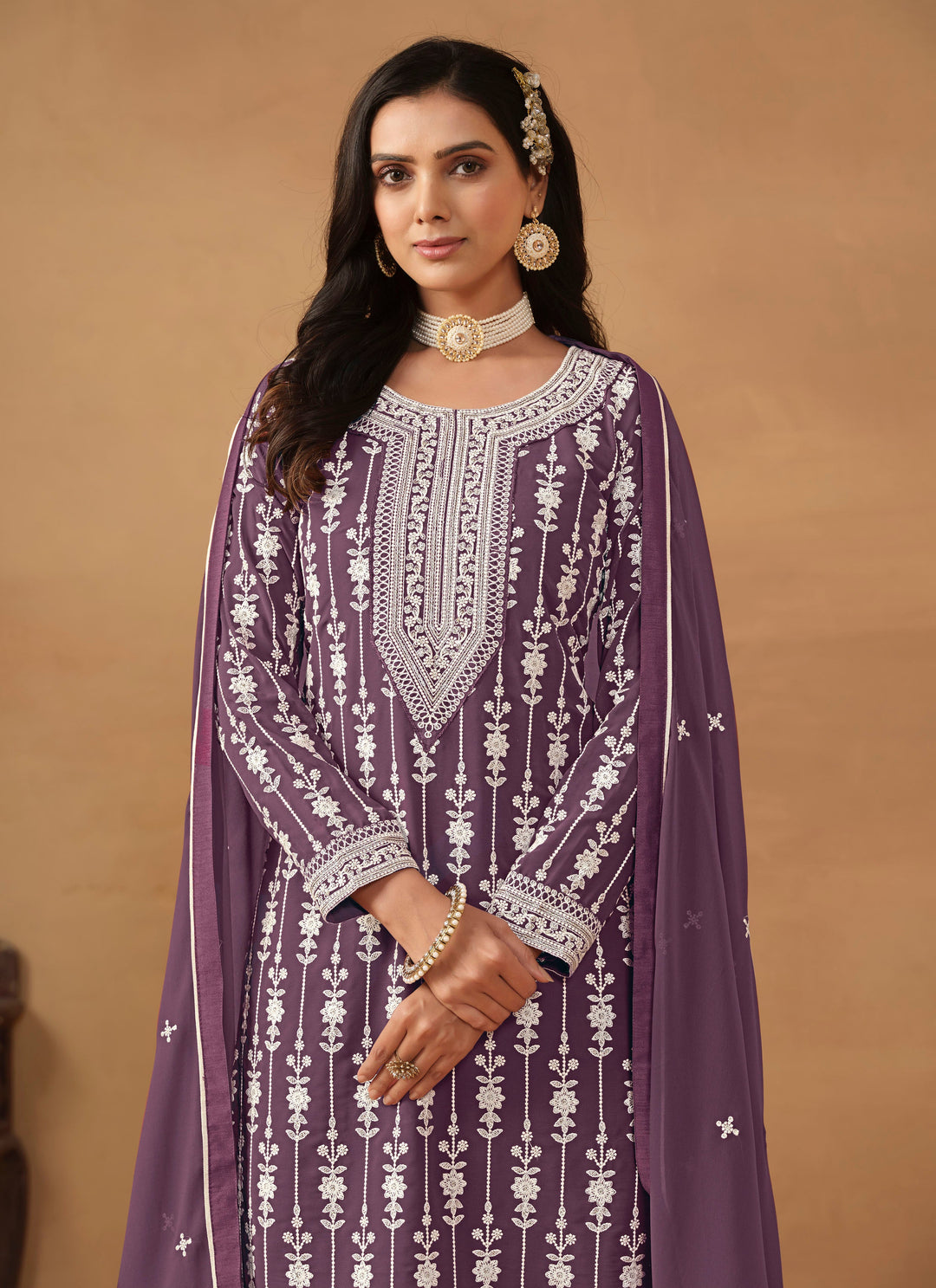 Purple faux georgette heavy thread embroidered salwar kameez, perfect for festive celebrations and parties.