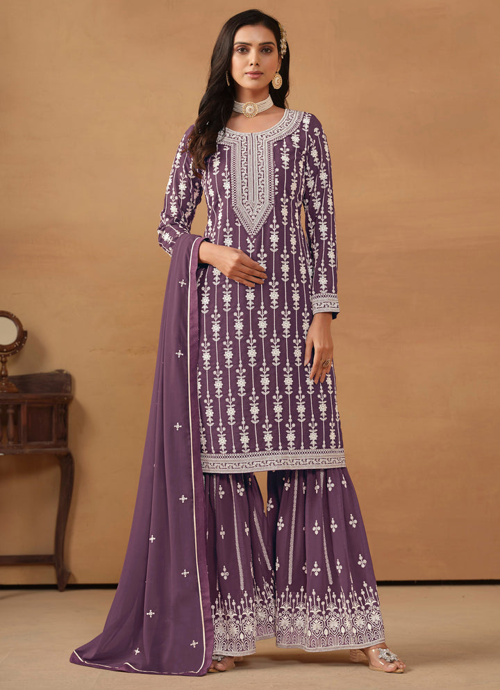 Elegant purple faux georgette salwar kameez with heavy thread embroidery and sequin work for special occasions.