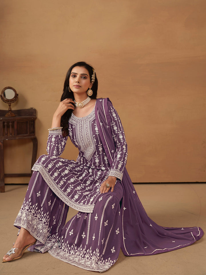 Luxurious purple salwar kameez with exquisite sequin work and detailed thread embroidery, ideal for weddings.