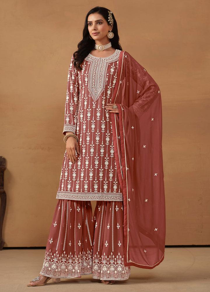 Stunning chocolate salwar kameez in faux georgette with intricate thread embroidery and shimmering sequin details for special events.