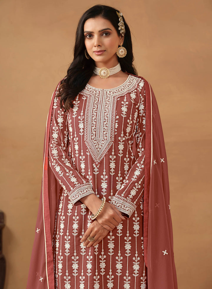 Luxurious chocolate faux georgette salwar kameez adorned with exquisite heavy embroidery and sequins, ideal for weddings.