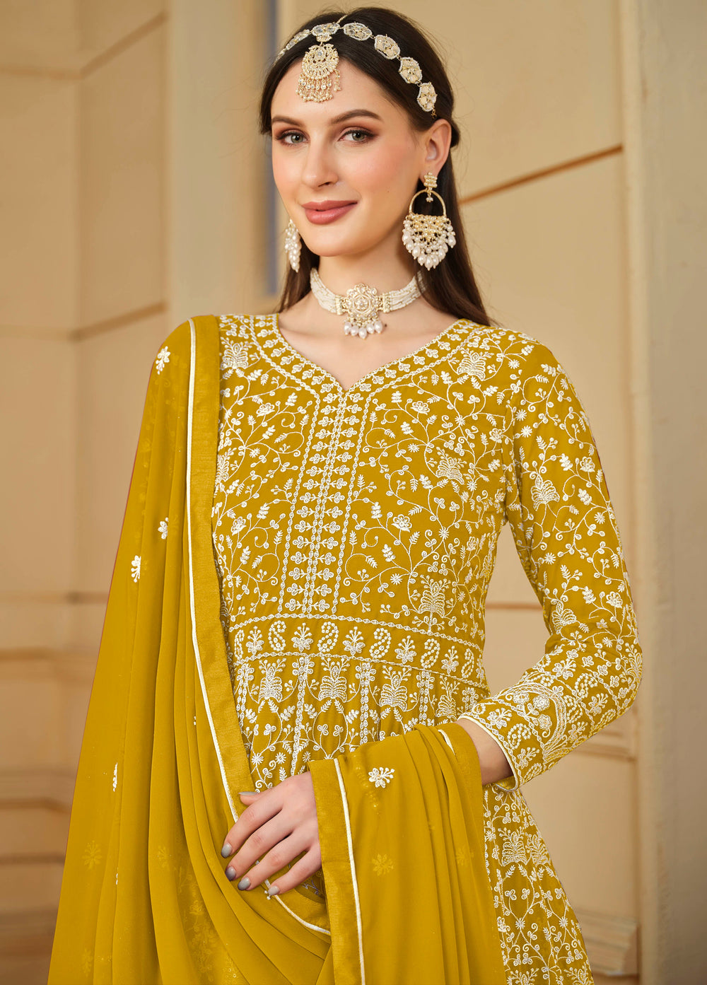 Stunning mustard salwar kameez in faux georgette with intricate thread embroidery and shimmering sequin work for special events.