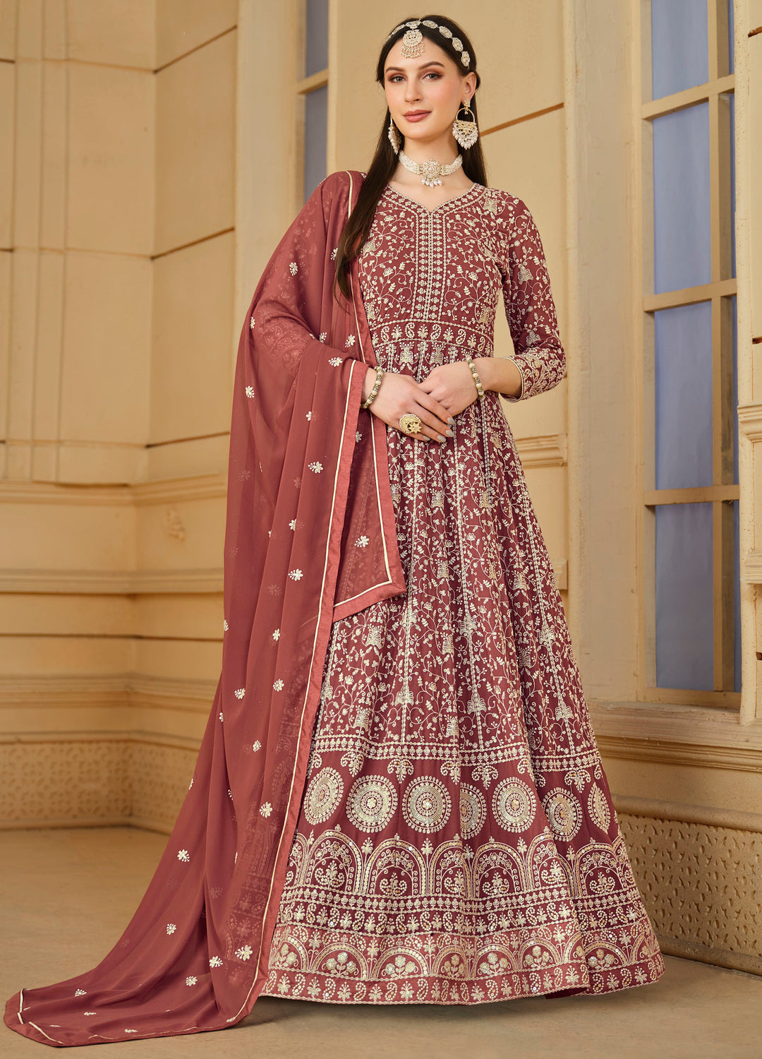 Elegant chocolate faux georgette salwar kameez featuring heavy thread embroidery and sequins, perfect for festive occasions.