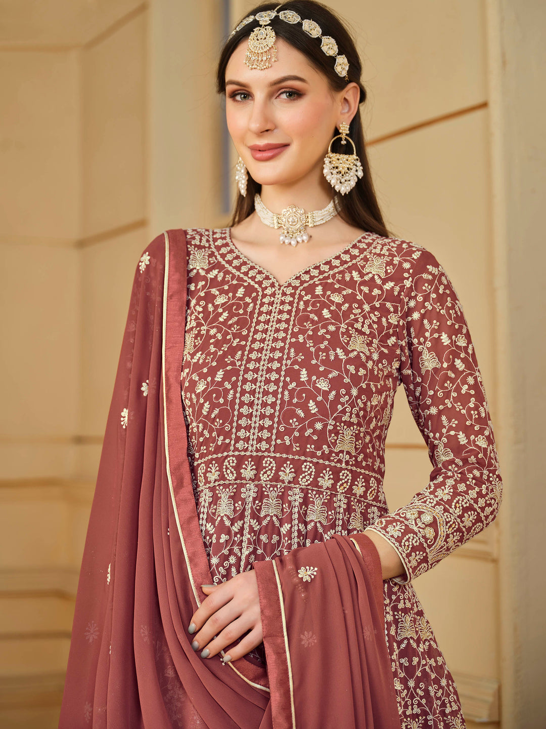 Stunning chocolate salwar kameez in faux georgette with intricate thread embroidery and shimmering sequin work for special events.