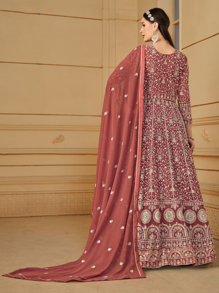 Luxurious chocolate faux georgette salwar kameez adorned with exquisite heavy embroidery and sequins, ideal for weddings.