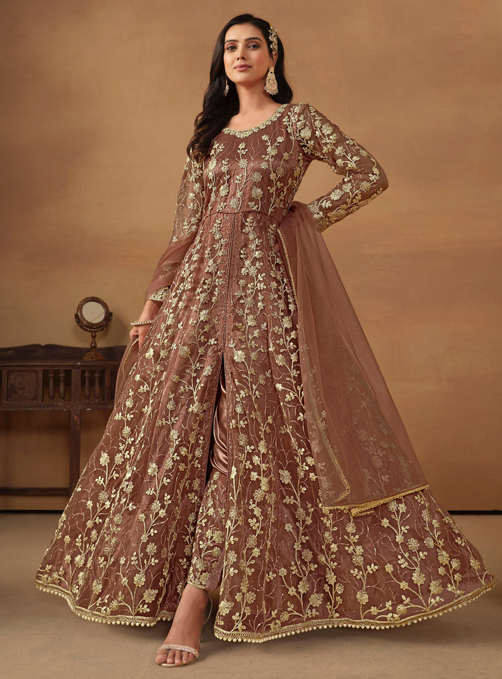 Elegant brown net salwar kameez featuring heavy thread embroidery and sequins, perfect for special occasions.