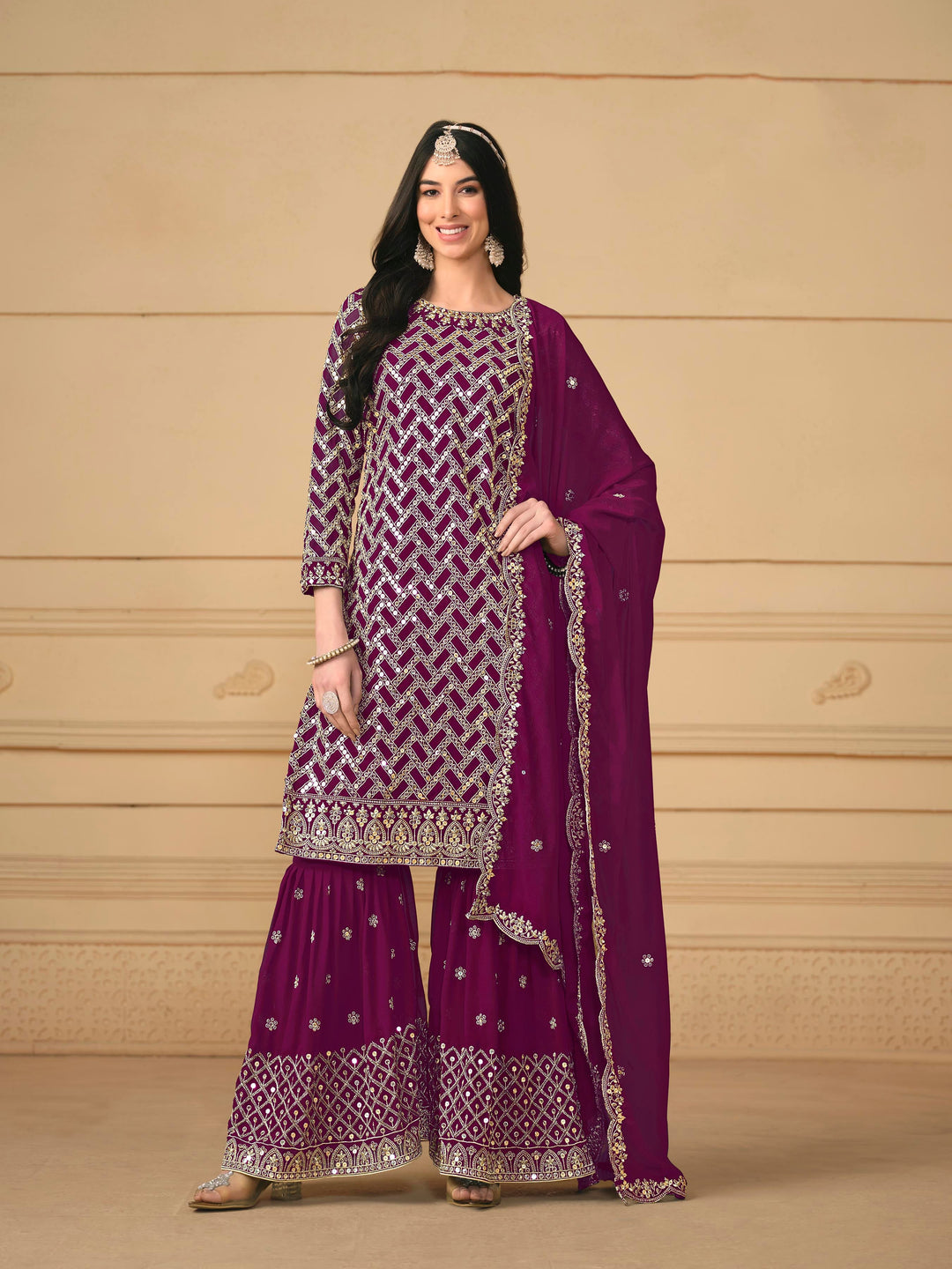 Stunning magenta salwar kameez in faux georgette with intricate thread embroidery and shimmering sequin work for special events.