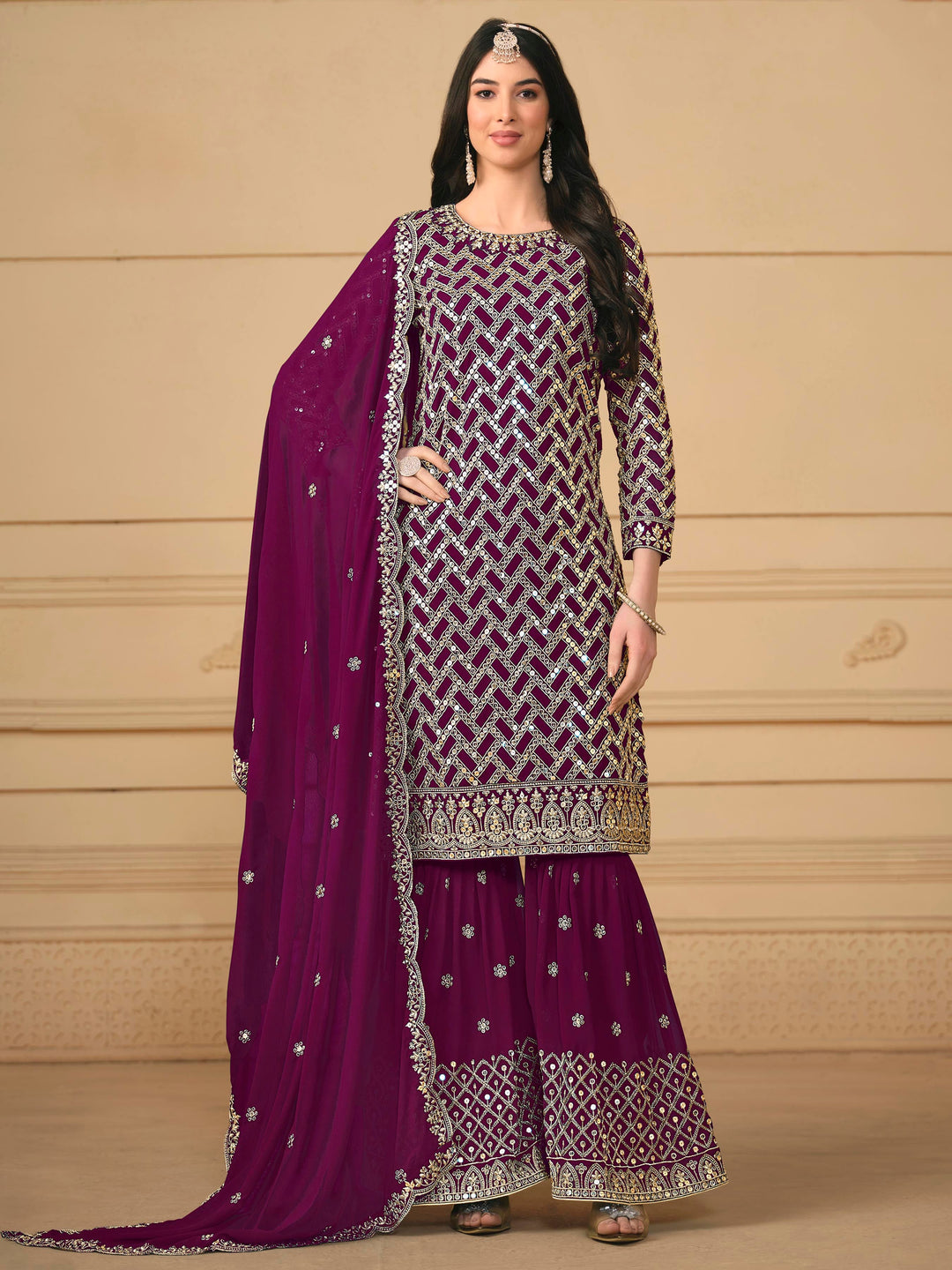 Elegant magenta faux georgette salwar kameez featuring heavy thread embroidery and sequins, perfect for festive occasions.