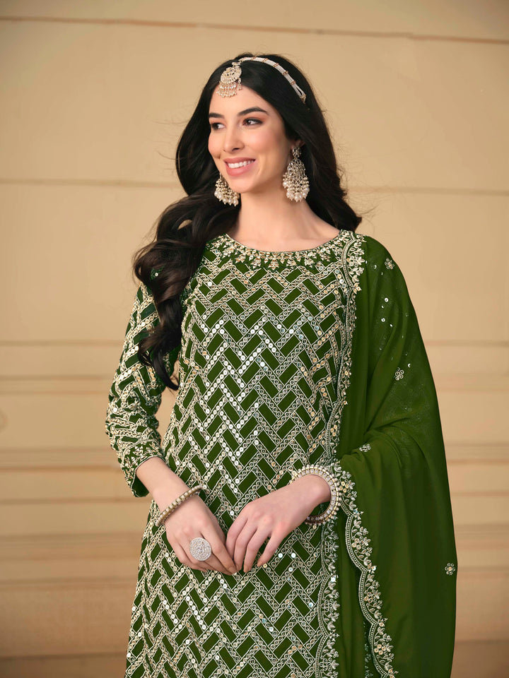 Luxurious mehendi faux georgette salwar kameez adorned with exquisite heavy embroidery and sequins, ideal for weddings.