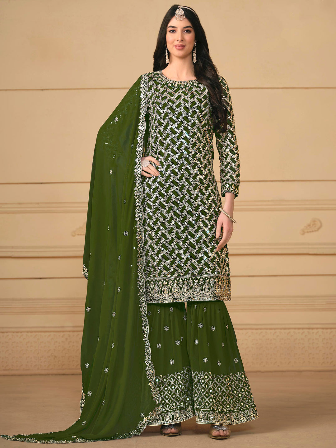 Elegant green faux georgette salwar kameez featuring heavy thread embroidery and sequins, perfect for festive occasions.