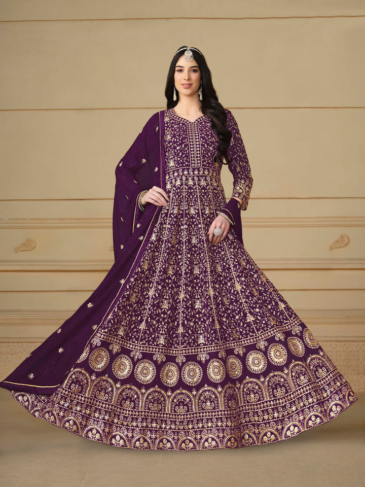 Stunning purple salwar kameez in faux georgette with intricate thread embroidery and shimmering sequin work for festive events.