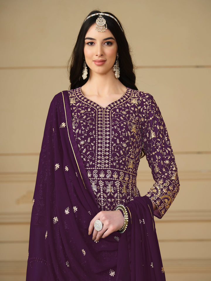 Luxurious purple faux georgette salwar kameez adorned with exquisite heavy embroidery and sequins, ideal for weddings.