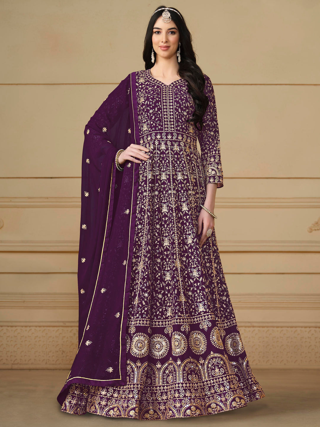 Elegant purple faux georgette salwar kameez featuring heavy thread embroidery and sequins, perfect for special occasions.