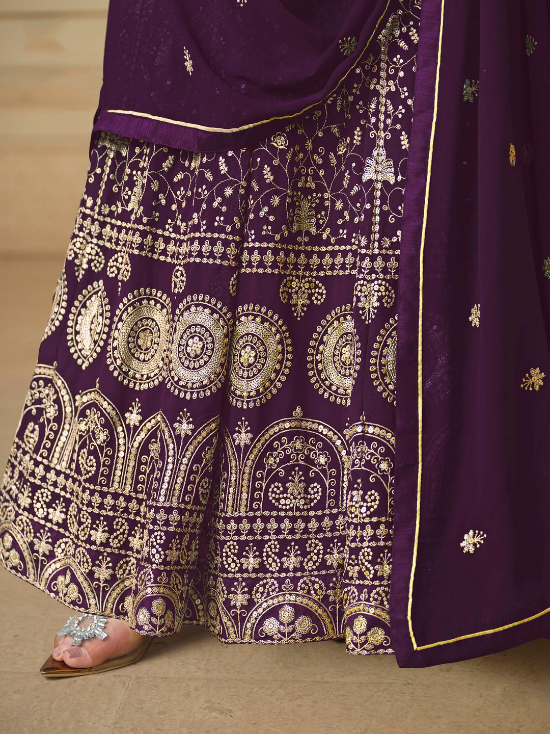 Beautiful purple salwar kameez crafted from faux georgette, showcasing intricate heavy thread and sequin embellishments.