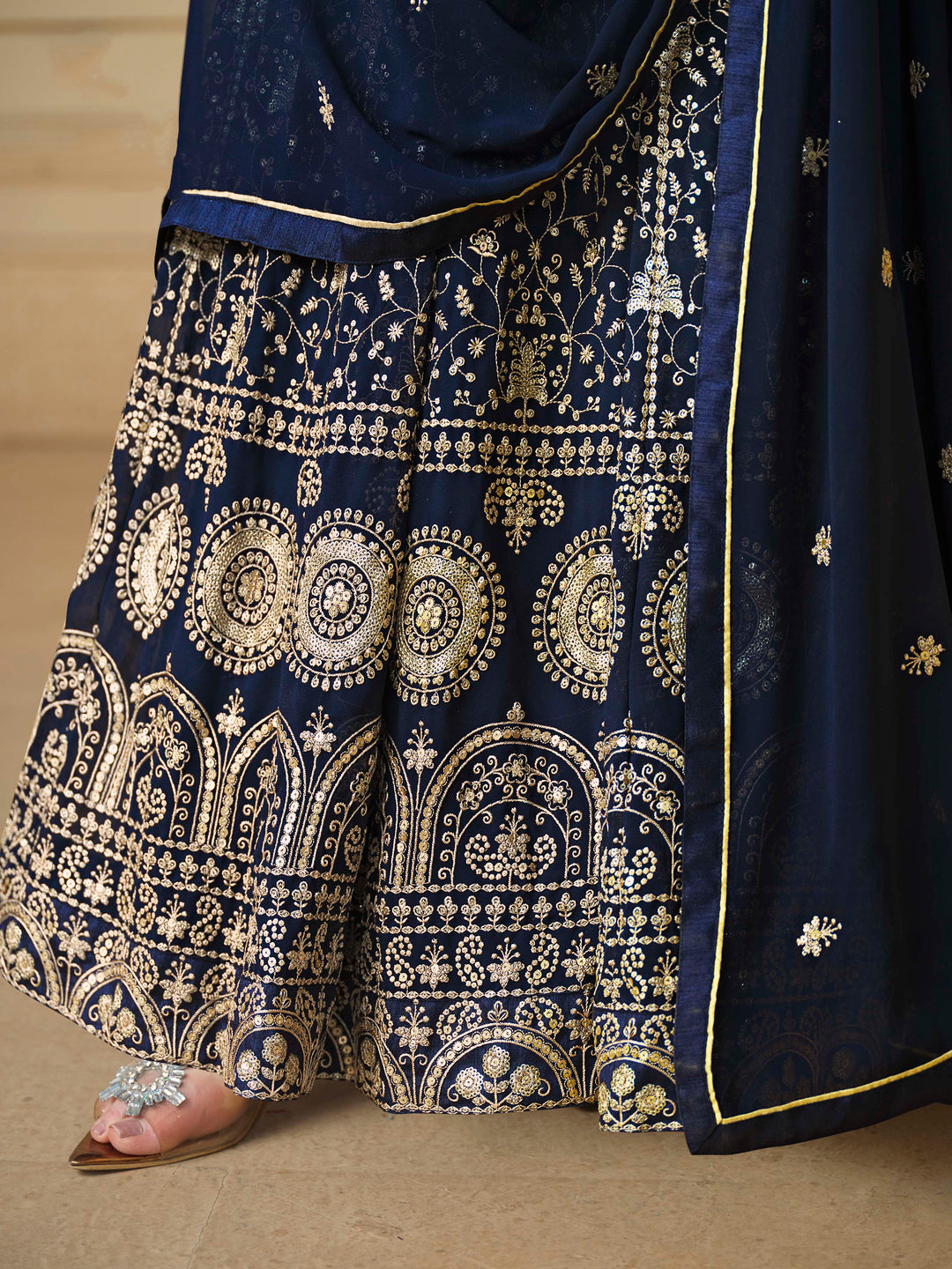 Beautiful navy blue salwar kameez crafted from faux georgette, showcasing intricate heavy thread and sequin embellishments.