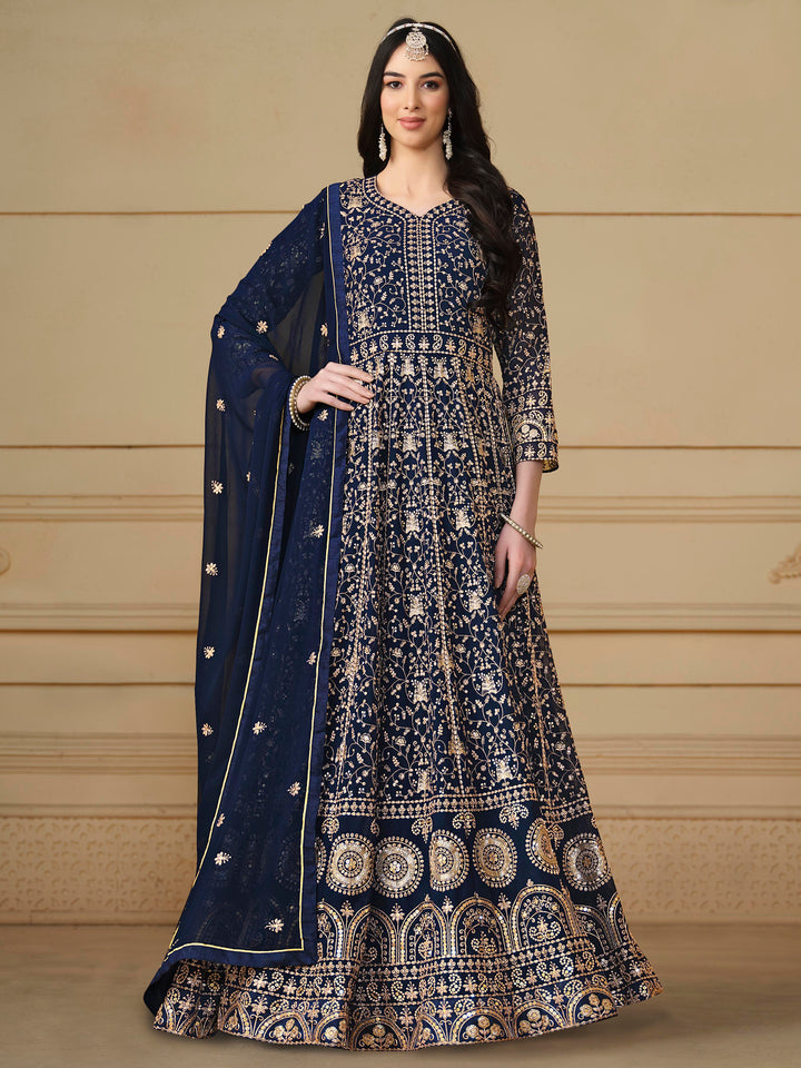 Elegant navy blue faux georgette salwar kameez featuring heavy thread embroidery and sequins, perfect for special occasions.