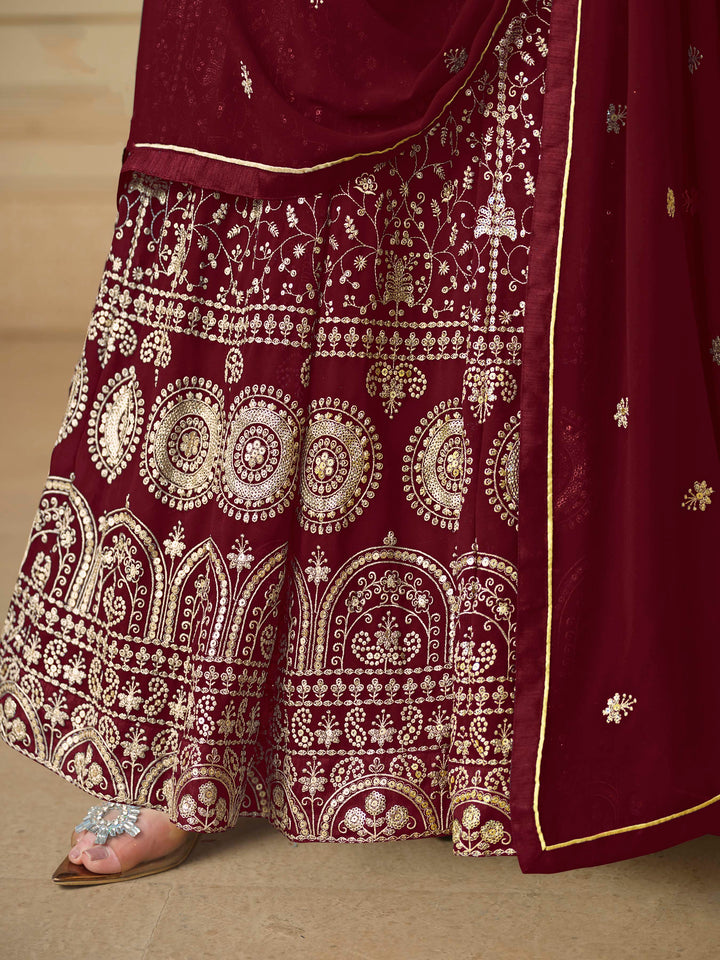 Beautiful maroon salwar kameez crafted from faux georgette, showcasing intricate heavy thread and sequin embellishments.