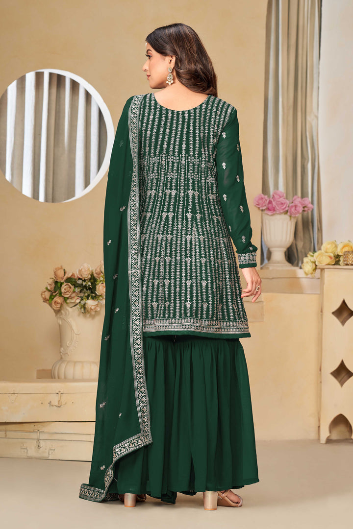 Beautiful dark green salwar kameez crafted from faux georgette, showcasing intricate heavy thread and sequin embellishments.