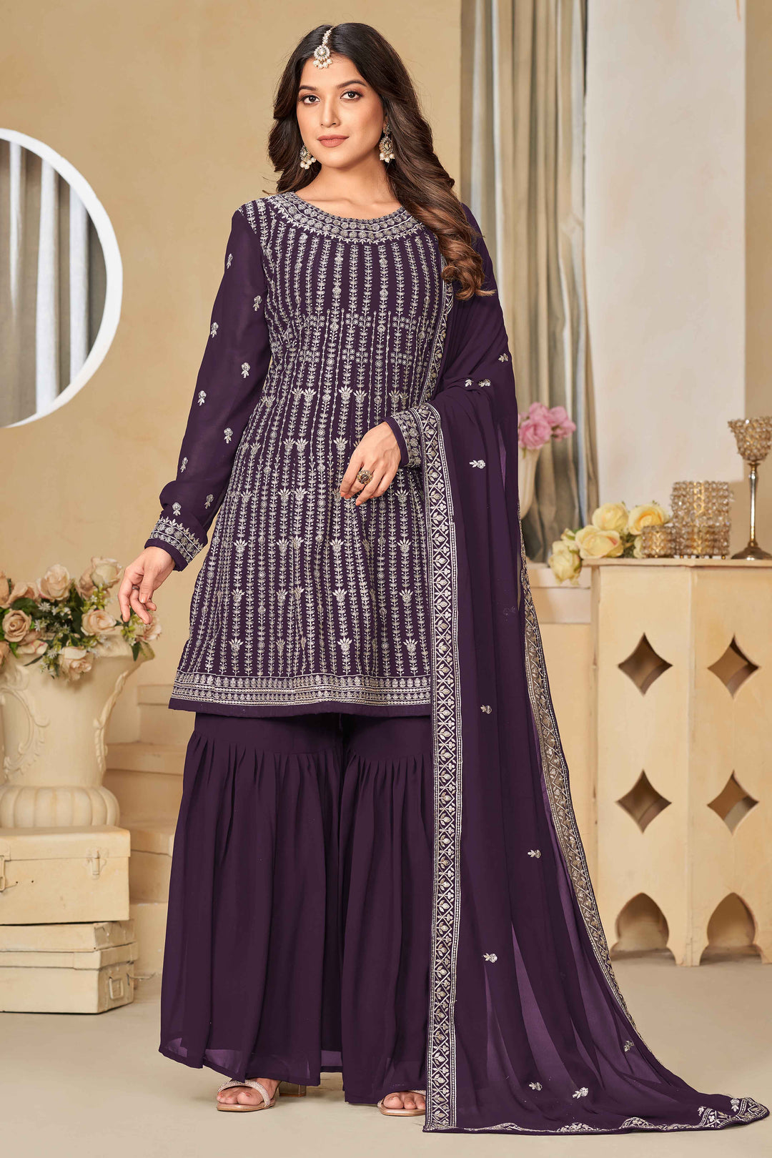 Stunning purple salwar kameez in faux georgette with intricate thread embroidery and shimmering sequin work for special events.