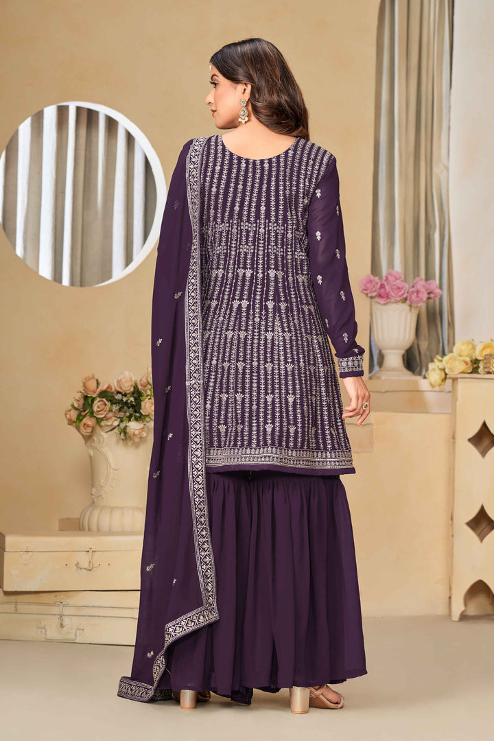 Beautiful purple salwar kameez crafted from faux georgette, showcasing intricate heavy thread and sequin embellishments.