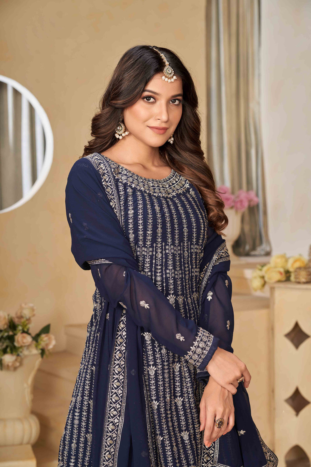 Luxurious navy blue faux georgette salwar kameez adorned with exquisite heavy embroidery and sequins, ideal for weddings.