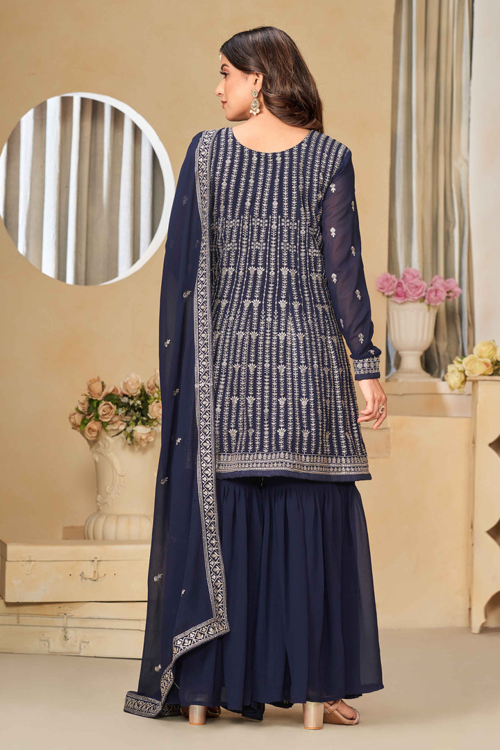 Beautiful navy blue salwar kameez crafted from faux georgette, showcasing intricate heavy thread and sequin embellishments.