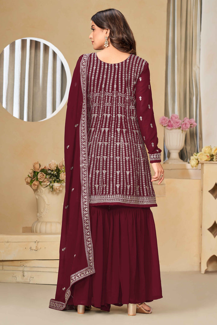 Beautiful maroon salwar kameez crafted from faux georgette, showcasing intricate heavy thread and sequin embellishments.