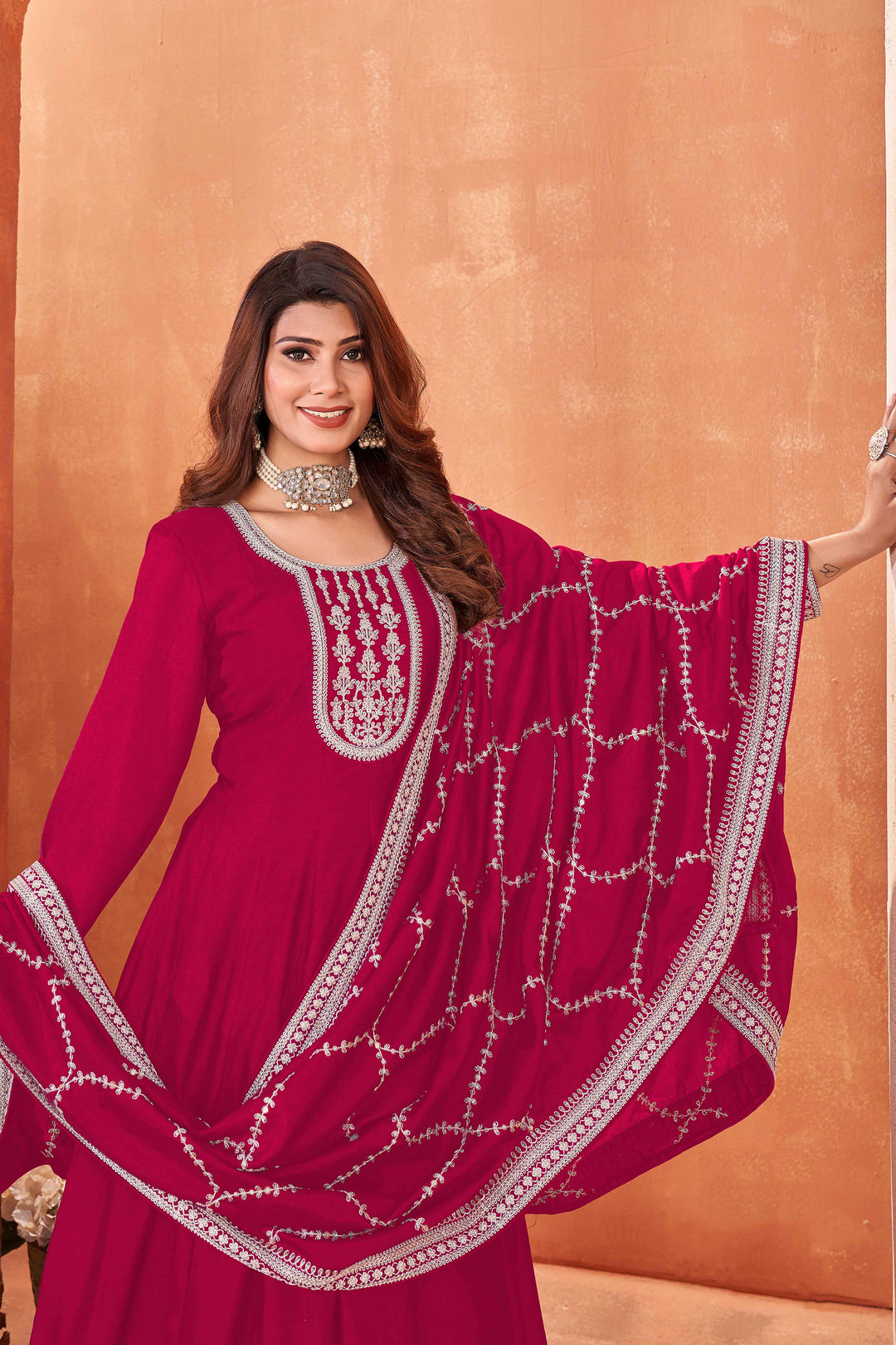 Luxurious rani pink art silk salwar kameez adorned with exquisite heavy embroidery and sequins, ideal for weddings.