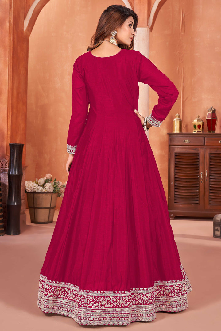 Beautiful rani pink salwar kameez crafted from art silk, showcasing intricate heavy thread and sequin embellishments.