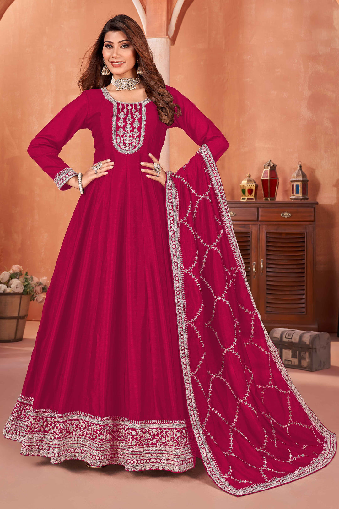 Elegant rani pink art silk salwar kameez featuring heavy thread embroidery and sequins, perfect for special occasions.