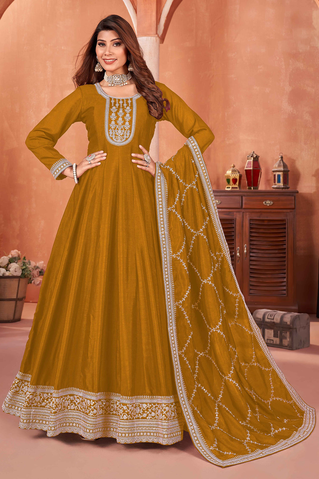 Elegant mustard art silk salwar kameez featuring heavy thread embroidery and sequins, perfect for special occasions.