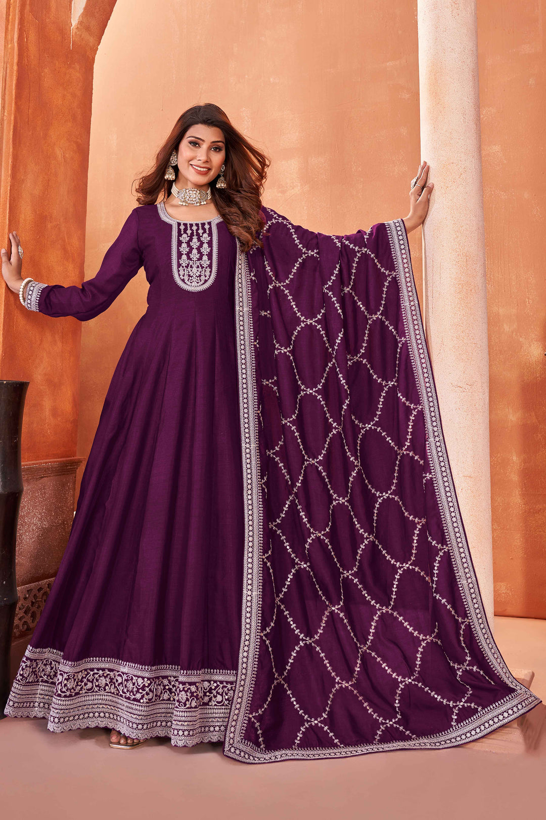 Stunning wine salwar kameez in art silk with intricate thread embroidery and shimmering sequin work for special events.