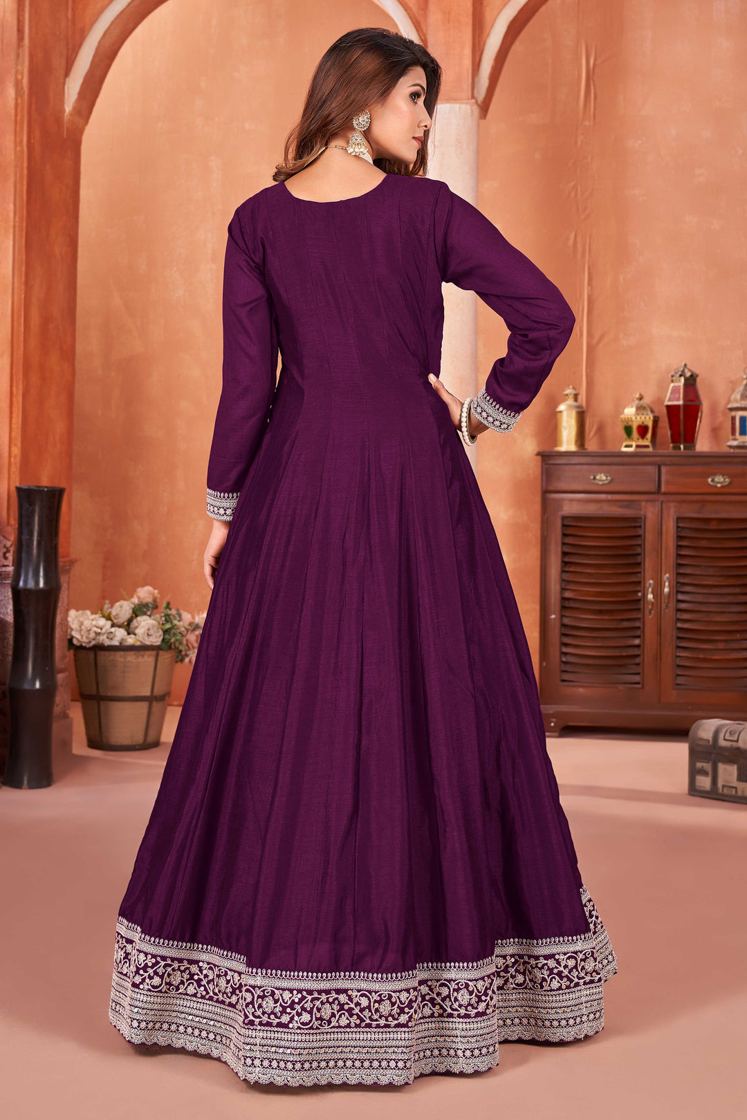 Beautiful wine salwar kameez crafted from art silk, showcasing intricate heavy thread and sequin embellishments.