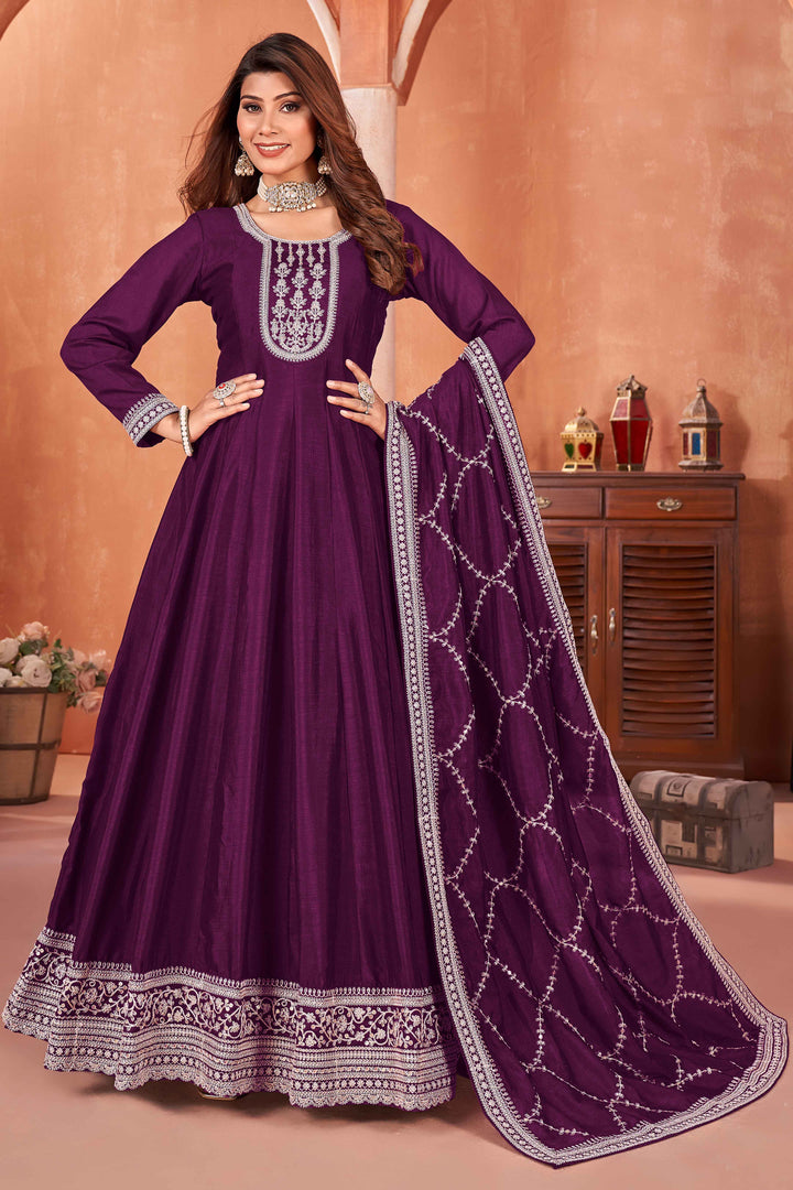 Elegant wine art silk salwar kameez featuring heavy thread embroidery and sequins, perfect for festive occasions.