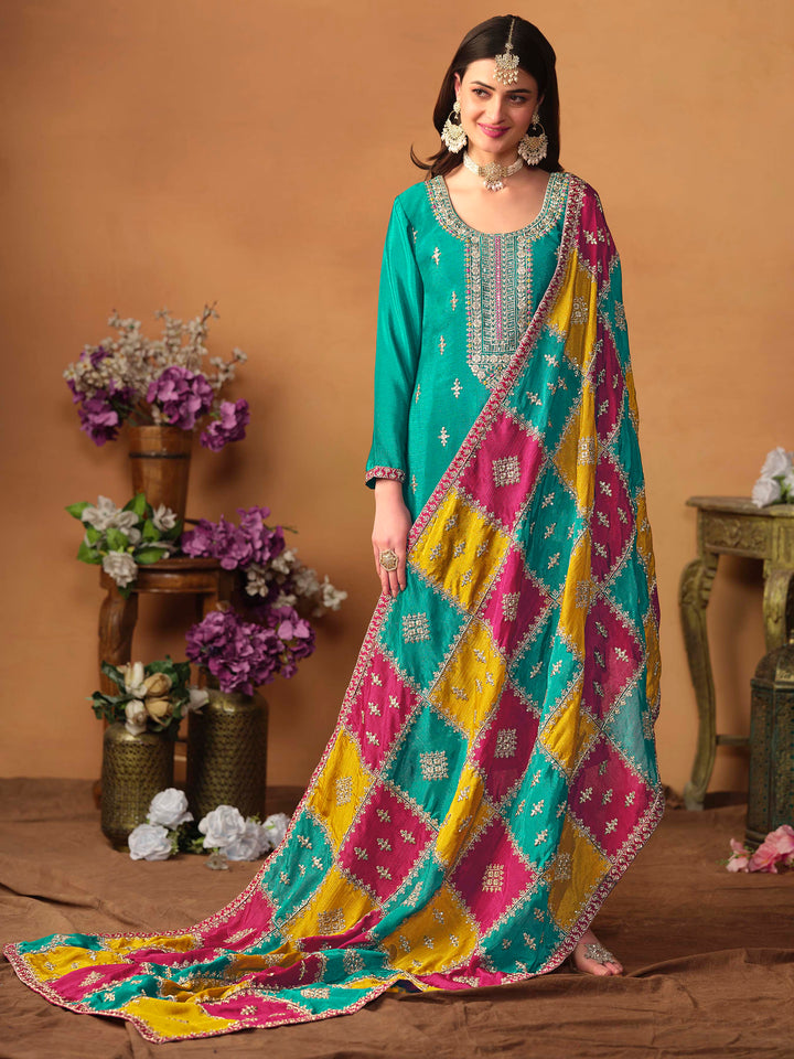 Beautiful teal green salwar kameez crafted from chinon silk, showcasing intricate heavy thread and sequin embellishments.