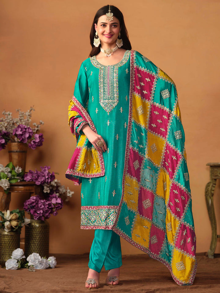 Elegant teal green chinon silk salwar kameez featuring heavy thread embroidery and sequins, perfect for special occasions.