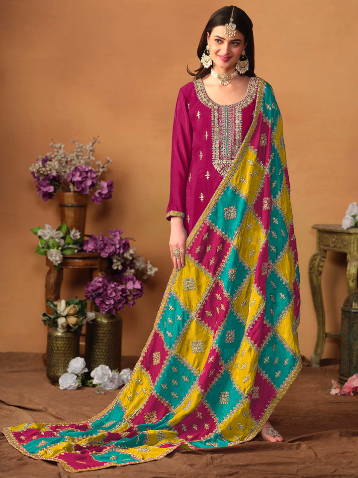 Beautiful rani pink salwar kameez crafted from chinon silk, showcasing intricate heavy thread and sequin embellishments.