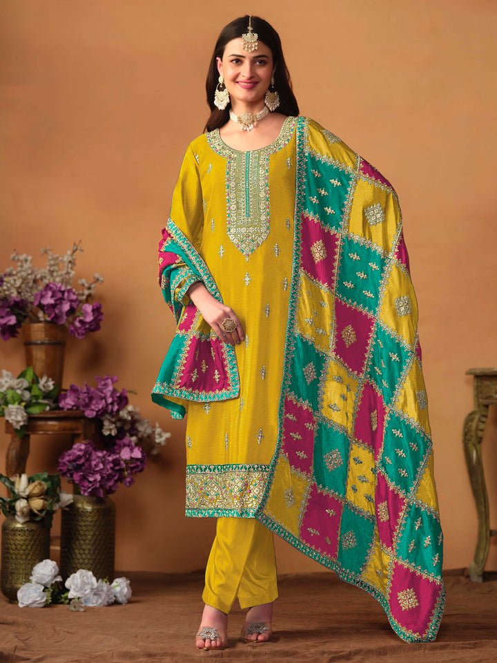 Elegant mustard chinon silk salwar kameez featuring heavy thread embroidery and sequins, perfect for special occasions.